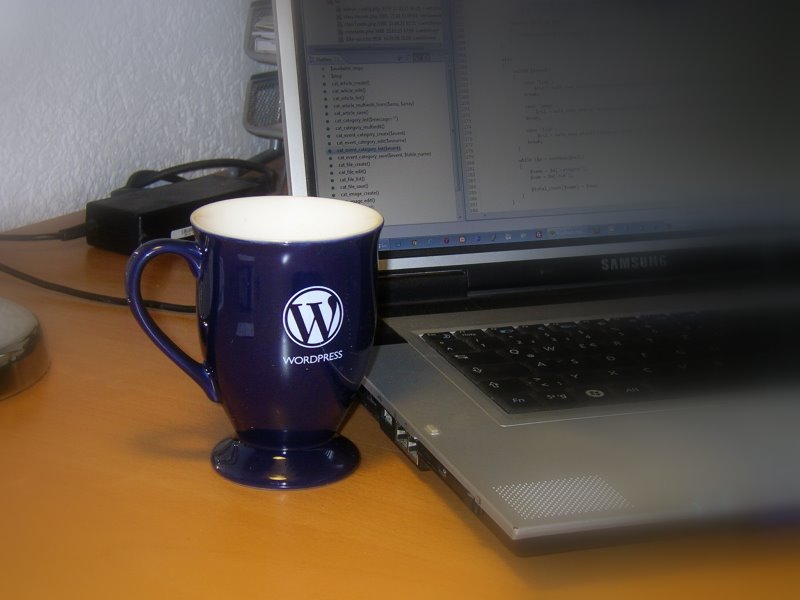 Wet with his WordPress cup.